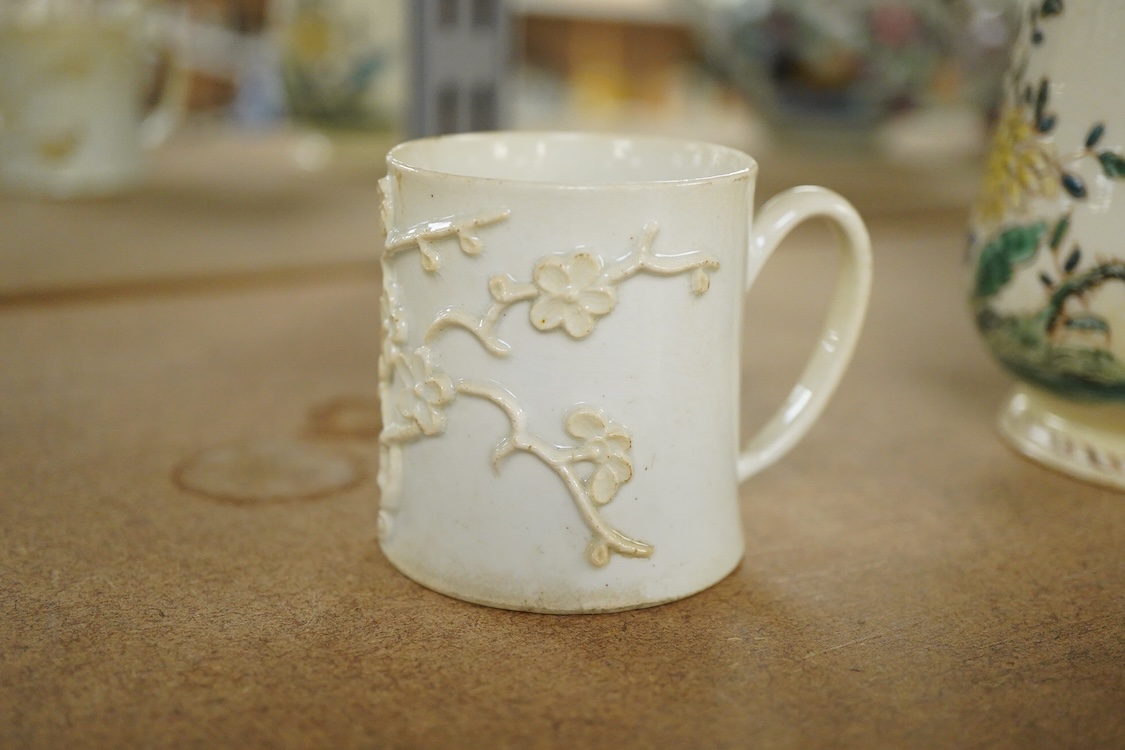 A Bow polychrome mug - 11.5cm high and a Bow prunus sprigged coffee can, c.1760-70